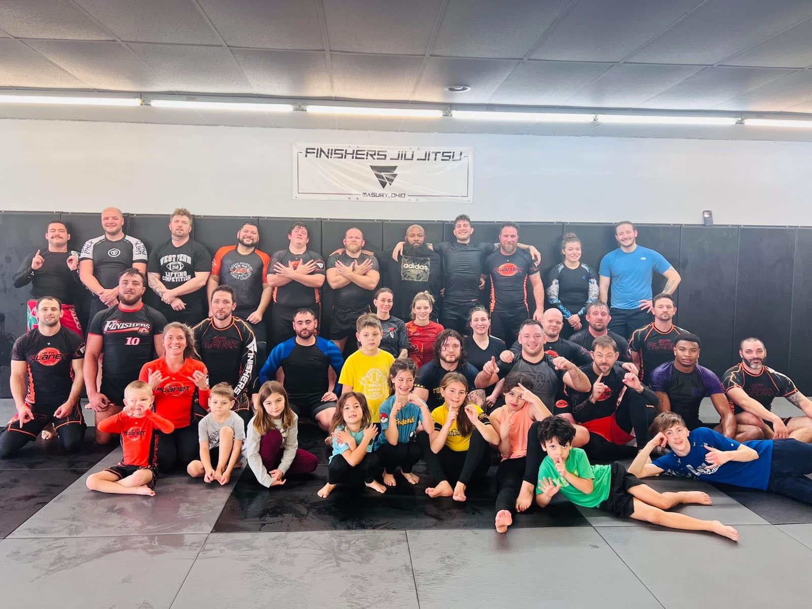 The 10th Planet Masury team, adults and kids together on the mats